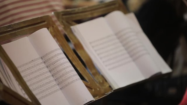 Close up footage of a music sheet with notes.