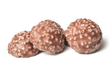 closeup of milk chocolate in shaped rock on white background