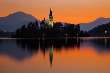 Fototapeta na wymiar Sunrise on Bled Lake with Pilgrimage Church, Bled, Slovenia, Europe.