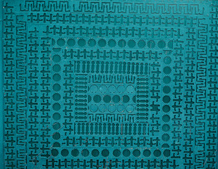 Iron Shabby Sheet Perforated by Different Geometric Shapes Painte By Blue Paint.