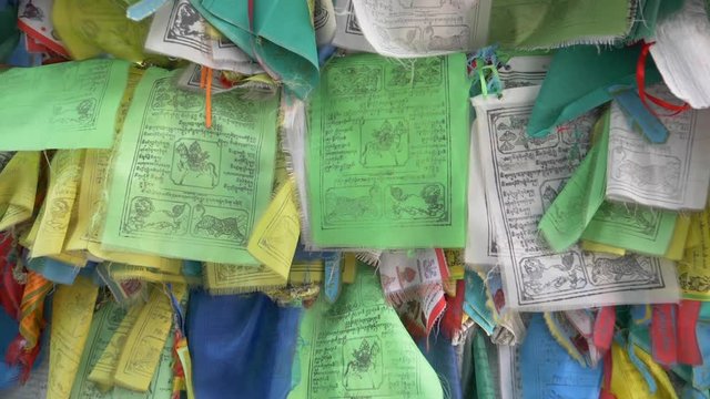 Colorful Tibetan prayer flags swaying in the wind in the temple, Ulan Ude Russia