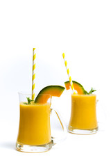 Sweet melon smoothie isolated on white