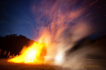 Big camp fire at night long exposure