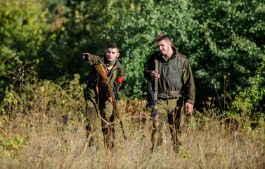 Activity for real men concept. Hunters gamekeepers looking for animal or bird. Hunting with...