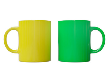 Two big mugs, yellow and green, isolated on white background. 3d image