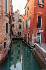 Italy, Venice, view of a canal between the buildings.