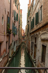 Fototapeta na wymiar Italy, Venice, view of a canal between the buildings.