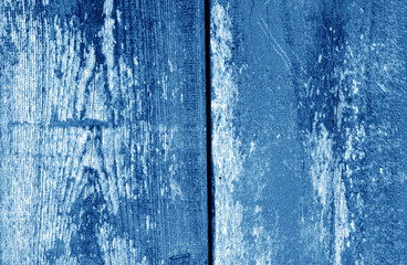 Fototapeta na wymiar Old grungy wooden planks background in navy blue tone.