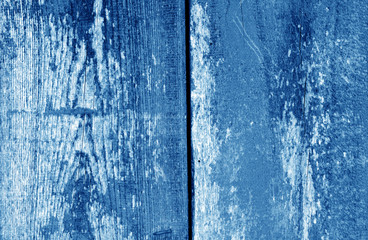 Old grungy wooden planks background in navy blue tone.