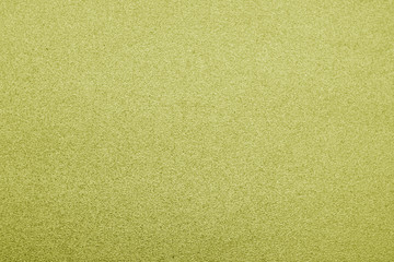 Plastic glittering texture in yellow color.