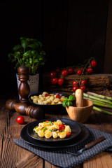 crispy gnocchi with roasted asparagus and tomatoes