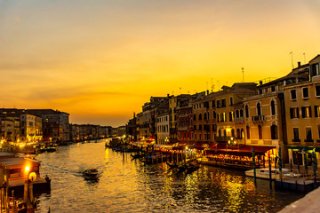 Fototapeta na wymiar Italy, Venice, view of the Grand Canal at sunset with boats and gondolas.
