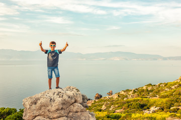 Young boy traveling along the coast of the Mediterranean Sea.