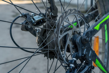 Closeup of a mechanism of bicycle mechanisms and chain on a mountain bike. Pedals from a mountain bike. Close the detailed view.