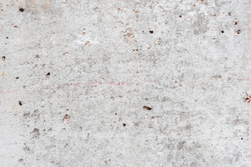 Wall fragment with scratches and cracks