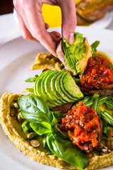 Hummus with avocado and capers