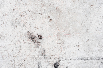 Wall fragment with scratches and cracks