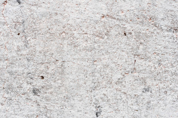 Wall fragment with scratches and cracks