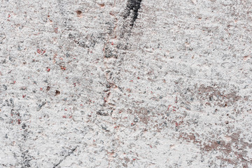 Wall fragment with scratches and cracks