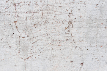 Wall fragment with scratches and cracks