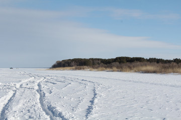 Car tracks on a frozen lake