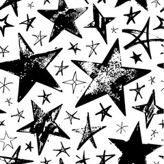 Seamless pattern with black hand drawn vector stars in doodle style isolated on white background. 