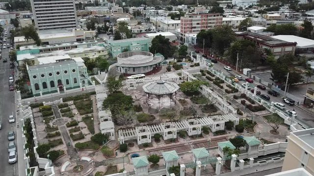 AERIAL: angled down wide rotation around the entirety of the Parque Urbano Dora Colon in Ponce, Puerto Rico on a cloudy day.