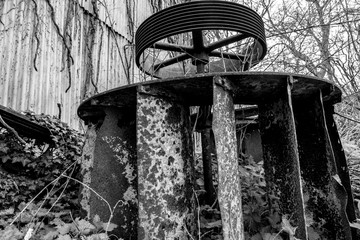 Post industrial water wheel abandoned and rusting