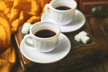 Two cups of coffee espresso near sugar cube