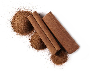 Cinnamon sticks and powder isolated on white background, top view