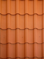 Close up view on red spanish clay roofing tiles background