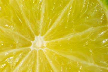 Bright juicy lime pulp close-up. High-quality image is suitable for topics: healthy lifestyle, vitamins, proper nutrition, diet, summer, fresh juices. Background fruit texture.