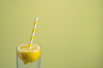Lemon with paper straw