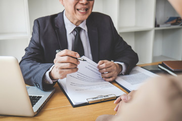 Interviewer or Board reading a resume during a job interview, Employer interviewing a young female...