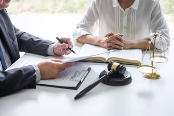 Businesswoman and Male lawyer or judge consult and conference having team meeting with client at law firm in office, Law and Legal services concept