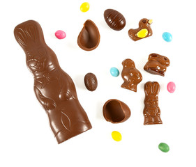 Easter composition with chocolate eggs and animals isolated on white