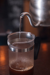Pouring the hot water into the french press