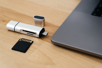 Digital Type-C USB Memory Card Reader, with gray laptop with USB Type-C port.