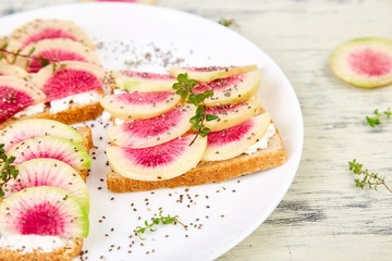 Healthy breakfast toasts from sliced watermelon radish