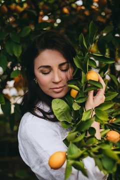 Beautiful woman on a lemon plantation