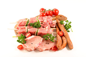 assorted raw meats isolated on white background