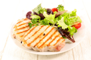 grilled pork chop and lettuce