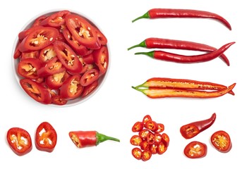 Set of fresh whole and sliced red chili pepper isolated on white background. Top view