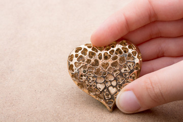 Heart shaped gold color metal object