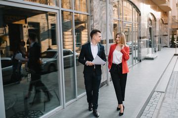 Fototapeta premium Business people walking and talking in the street