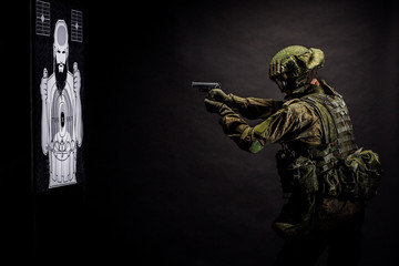 russian special forces soldier with rifle on dark background. army, military and people concept