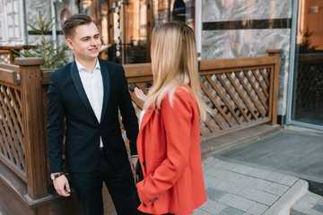 Fototapeta premium Business people walking and talking in the street ear of modern building.