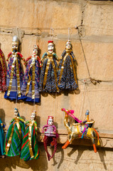 Colorful Kathputli or Puppets displayed on the wall, near Patwon Ki Haveli, Jaisalmer, Rajasthan,...