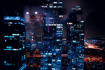 Fototapeta na wymiar landscape skyscrapers night / business center in a night landscape, winter lights in the windows of houses in the business district
