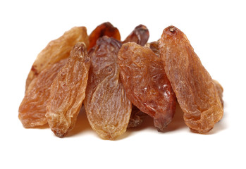 green raisin stacked together on white background